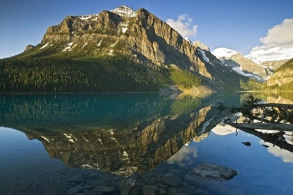 Canada, Alberta, Banff National Park, Rocky Mountains and boulders reflected in Lake Louise