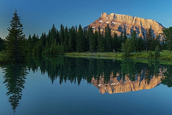 Canada, Alberta, Banff National Park. Mt. Rundle reflected in Cascade Pond at sunrise