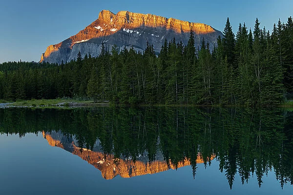 Canada, Alberta, Banff National Park. Mt. Rundle reflected in Cascade Pond at sunrise