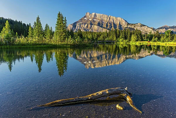 Canada, Alberta, Banff National Park. Mt. Rundle reflected in Two Jack Lake at sunrise