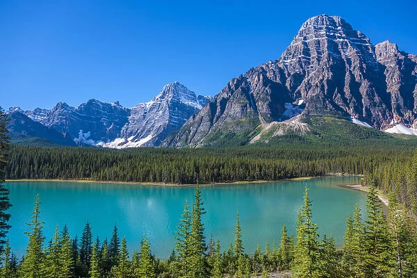 Canada, Alberta. Glacial Silt colors Waterfowl Lake blue with Howse Peak in view
