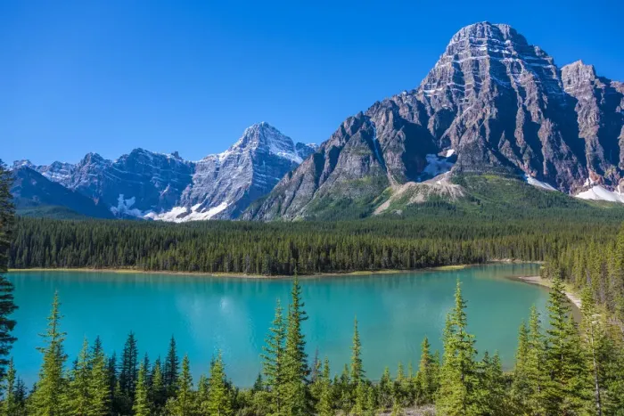 Framed Print : Canada, Alberta. Glacial Silt colors Waterfowl Lake blue with Howse Peak in view