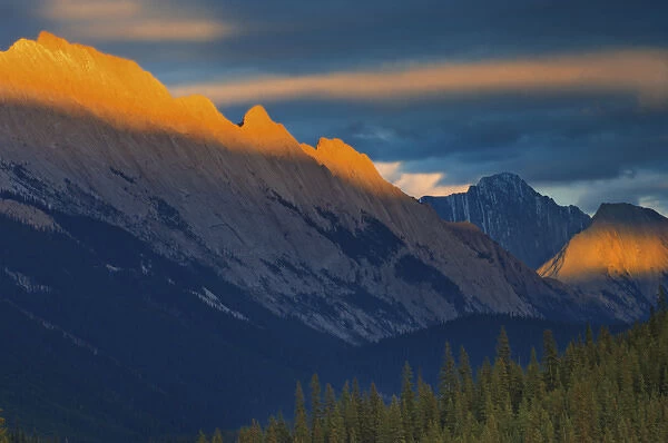 Canada, Alberta, Jasper National Park. Sunset on the summit of the Colin Range. Credit as