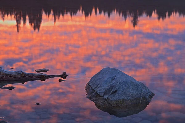 Canada, Alberta, Jasper National Park. Clouds at sunrise reflected in Patricia Lake