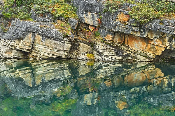 Canada, Alberta, Jasper National Park. Reflection of rocks in Horseshoe Lake