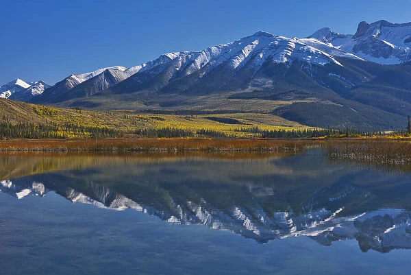 Canada, Alberta, Jasper National Park. Mountains reflected in Talbot Lake