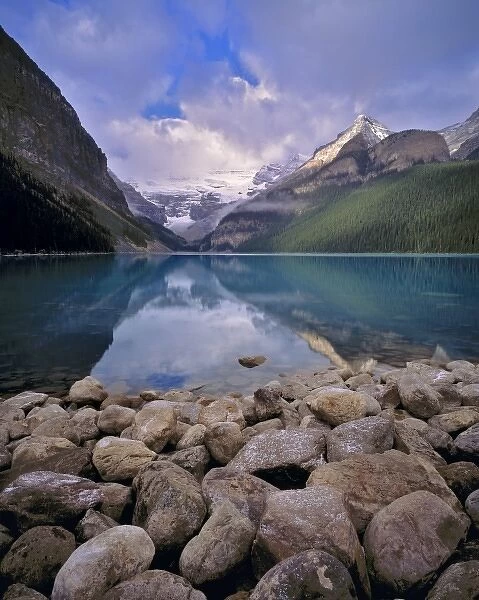 Canada, Alberta, Lake Louise. The still waters of Lake Louise reflect the Canadian Rockies