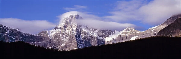 Canada, Alberta, Mt. Chephren. Wind whips the snow off Mt. Chephren in Banff NP