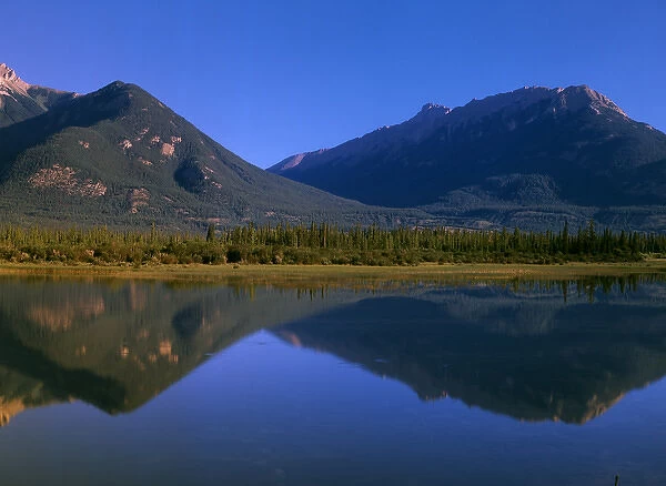 Canada, Alberta, View of Canadian Rockies reflected in Jasper Lake
