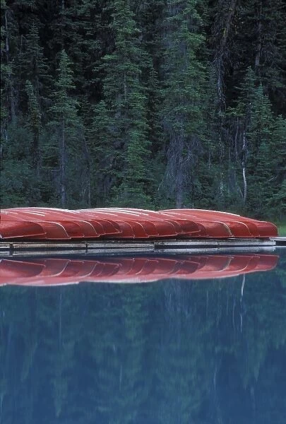 Canada, Banff, Alberta. Canoes line the shores of Lake Louise