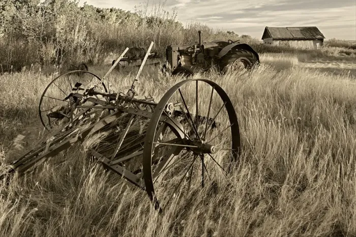 Framed Print : Canada. Black and white of old farm machinery in field
