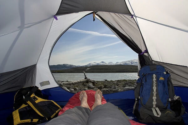 Canada, British Columbia, Alsek River Valley. View of Alsek River from inside camp tent