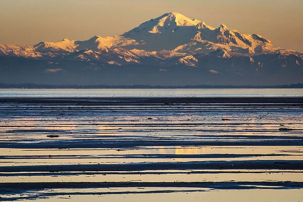 Canada, British Columbia. Boundary Bay, Mount Baker from the shoreline at sunset