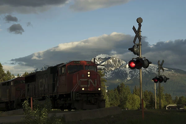 Canada: British Columbia, Valemount, train tracks and light in front of Canoe Mountain