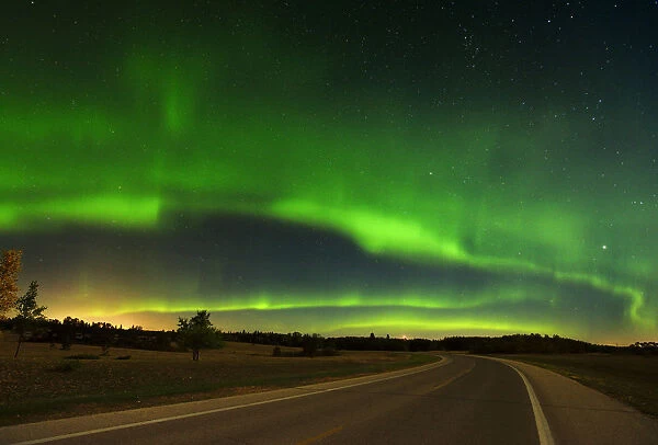 Canada, Manitoba, Birds Hill Provincial Park. Aurora borealis and road. Credit as