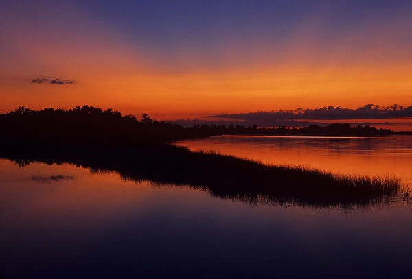 Canada, Manitoba, Grand Marais. Crepuscular or God rays over Lake Winnipeg at dusk