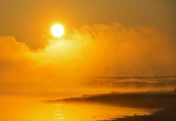Canada, Manitoba, Riding Mountain National Park. Fog rising above Whirlpool Lake at