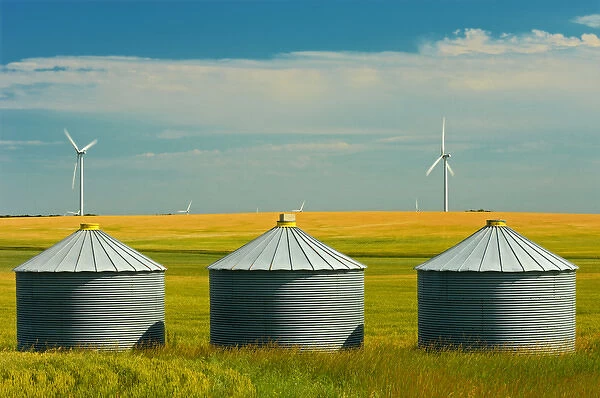 Canada, Manitoba, Somerset. Wind turbines and grain bins