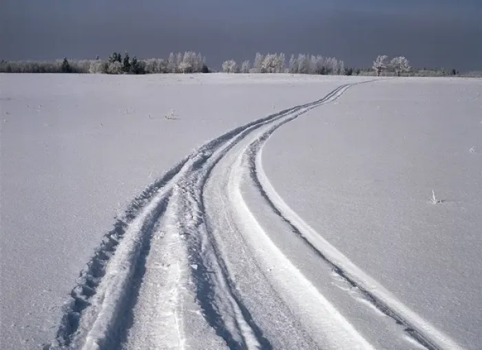 Framed Print : Canada, Manitoba, Tire tracks in snow landscape