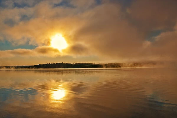 Canada, New Brunswick. Fog on Saint John River at sunrise