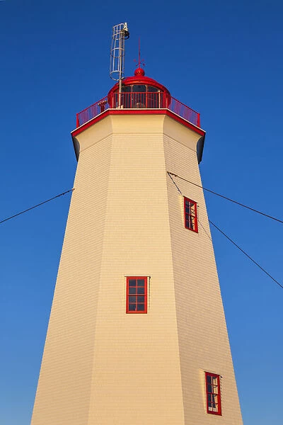 Canada, New Brunswick, Miscou Island. Miscou Lighthouse at sunset