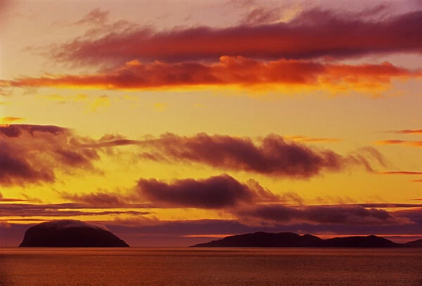 Canada, Newfoundland, York Harbour. Fiery sky over Gulf of St. Lawrence at sunset