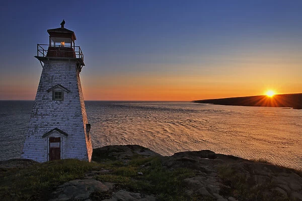Canada, Nova Scotia, Long Island. Boars Head Lighthouse at sunrise. Credit as