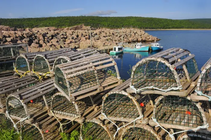 Framed Print : Canada, Nova Scotia, Neils Harbour. Boats and lobster traps in coastal village. Credit as Framed Print : Canada, Nova Scotia, Neils Harbour. Boats and lobster traps in coastal village. Credit as