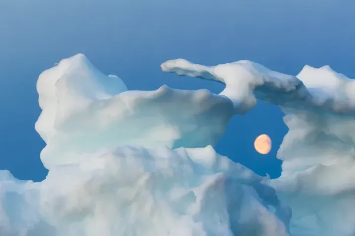 Framed Print : Canada, Nunavut, Territory, Moonrise framed in arch of melting iceberg along Frozen
