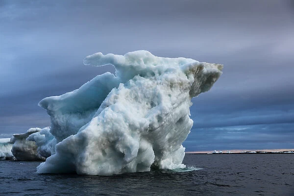 Canada, Nunavut Territory, Repulse Bay, Melting iceberg grounded in Harbour Islands