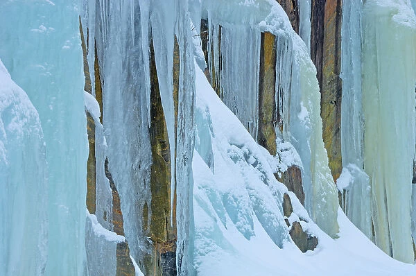Canada, Ontario, Baysville. Ice from frozen waterfall on side of rock face. Credit as