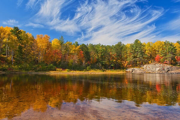 Canada, Ontario, Chutes Provincial Park. Reflection on the Aux Sables River in autumn