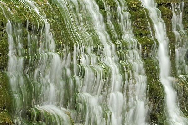 Canada, Ontario, Grimsby. Beamer Falls water cascades down moss-covered cliff. Credit as