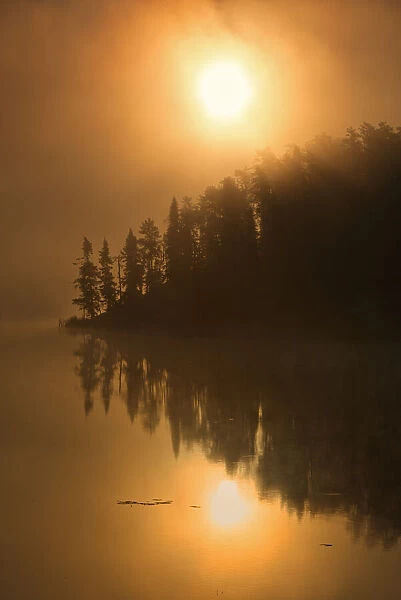 Canada, Ontario, Kenora. Isabel Lake in fog at sunrise. Credit as