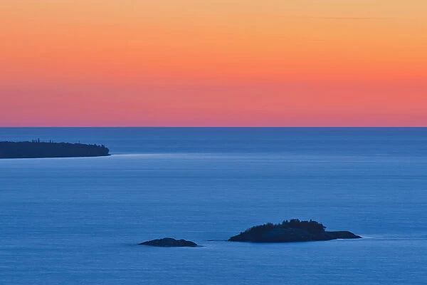 Canada, Ontario, Lake Superior Provincial Park. Islands in Lake Superior at sunset