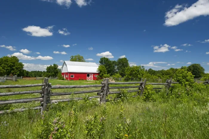 Framed Print : Canada, Ontario, Limoges. Red barn and wooden fence. Credit as