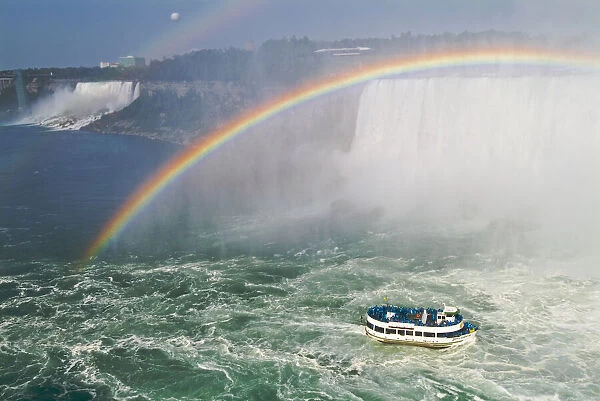 Canada, Ontario, Niagara Falls. Maid of the Mist tour boat and rainbow