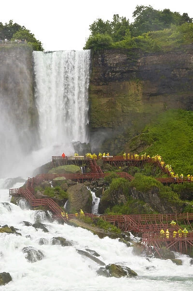 Canada, Ontario, Niagara Falls. Tourists use cliff-side walkways to experience the waterfalls