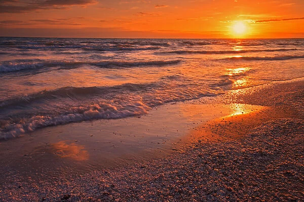 Canada, Ontario, Sandbanks Provincial Park, Waves on Lake Ontario beach at sunset