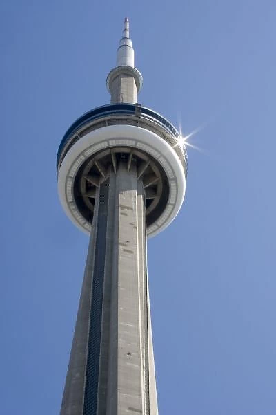 Canada, Ontario, Toronto. Top of CN Tower with sun star burst reflected on the top disc