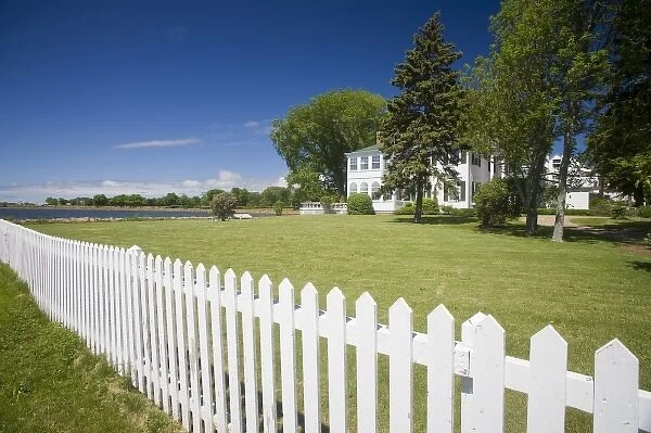 Canada, Prince Edward Island, Charlottetown. Historic waterfront house with white picket fence
