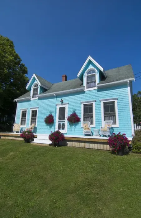 Framed Print : Canada Prince Edward Island, P. E. I. Victoria beautiful blue Victorian home with porch chairs Framed Print : Canada Prince Edward Island, P. E. I. Victoria beautiful blue Victorian home with porch chairs