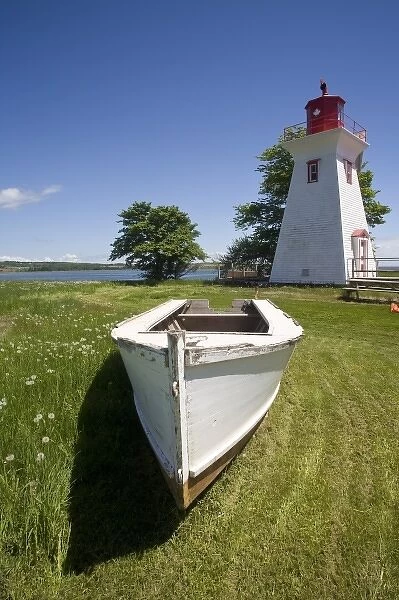 Canada, Prince Edward Island, Victoria. Lighthouse with maple leaf, and rescue boat
