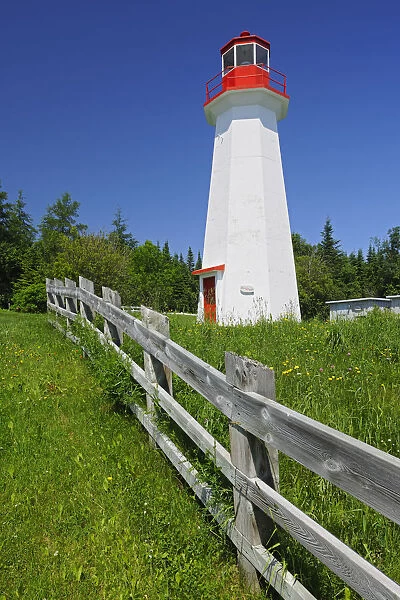 Canada, Quebec, Cap-de-Bon-De sir. Lighthouse and fence
