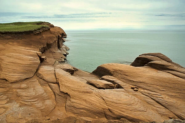 Canada, Quebec, Iles-de-la-Madeleine. Red cliffs and ocean