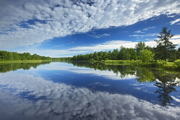 Canada, Quebec, Latulipe. Cloud reflection on Riviere Fraser