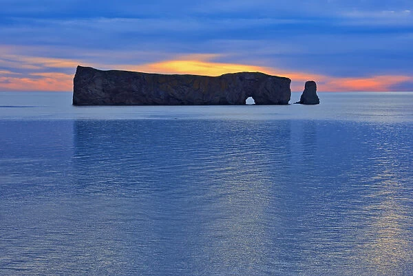 Canada, Quebec, Perce. Perce Rock in Atlantic Ocean at sunset