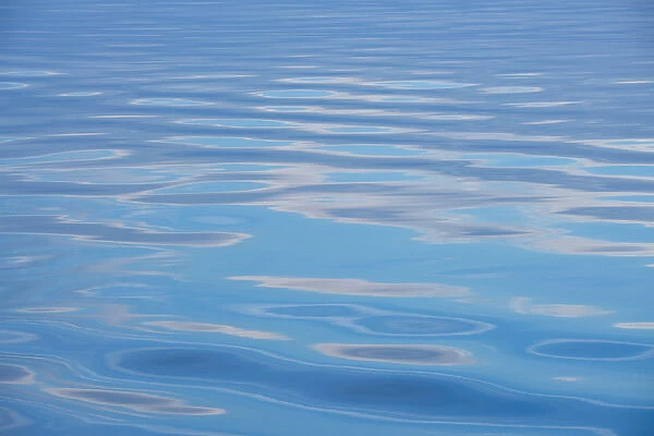 Canada, Quebec, Saguenay, Saguenaya'St. Lawrence Marine Park. Clouds reflected in calm sea