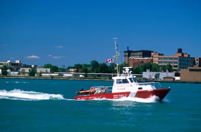 Framed Print : A Canadian coastguard boat patrols the Detroit River between Michigan and Windsor Framed Print : A Canadian coastguard boat patrols the Detroit River between Michigan and Windsor