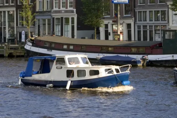 Framed Print : Canal boat on the Amstel River in Amsterdam, Netherlands Framed Print : Canal boat on the Amstel River in Amsterdam, Netherlands